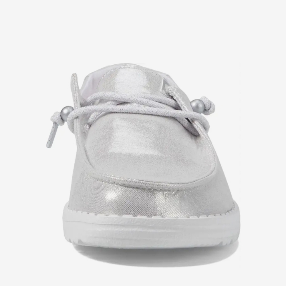 Silver metallic Hey Dude shoes.